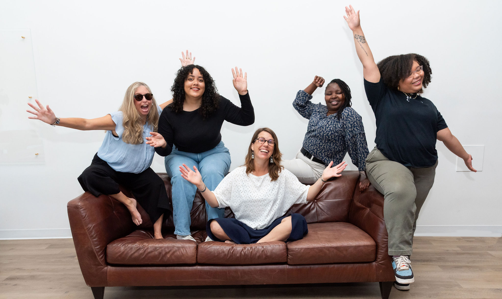 The ACE Project Team posing on a couch. 